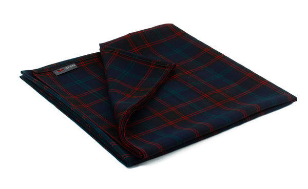 The Large Shepherd's Wool Utility Cloth in Home Modern Tartan (red and green grid on a black field).